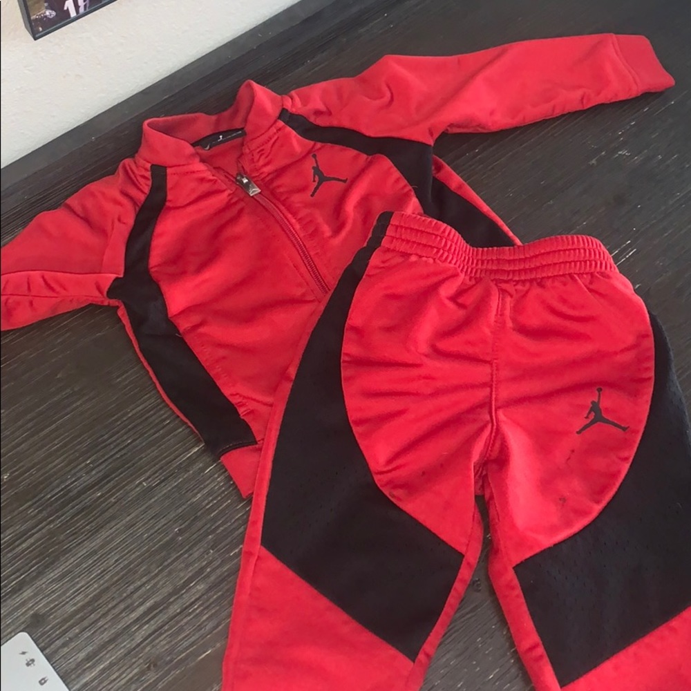 Jordan 2 piece jump suite.  Red and black zip up.